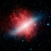 This infrared image from NASA's Spitzer Space Telescope shows a galaxy that appears to be sizzling hot, with huge plumes of smoke swirling around it. The galaxy is known as Messier 82 or the 'Cigar galaxy.'