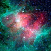 This majestic view taken by NASA's Spitzer Space Telescope tells an untold story of life and death in the Eagle nebula, an industrious star-making factory located 7,000 light-years away in the Serpens constellation. 