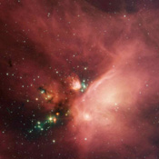 Newborn stars peek out from beneath their natal blanket of dust in this dynamic image of the Rho Ophiuchi dark cloud from NASA's Spitzer Space Telescope. This nebula is about 407 light years away from Earth.